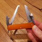 Coltello multiuso Fox Vulpis VP130-S4 OR alluminio arancione